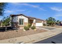 Inviting single-story home featuring desert landscaping, a two-car garage, and a welcoming entrance at 4208 E Indigo St, Gilbert, AZ 85298