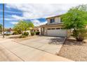Charming two-story home with neutral paint, desert landscaping, and two car garage at 4245 E Shannon St, Gilbert, AZ 85295