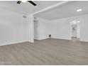 Spacious, freshly painted living area with modern flooring and a minimalist aesthetic at 437 W 6Th Pl, Mesa, AZ 85201