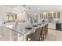 Large open kitchen with a skylight, large island, and stainless steel appliances at 511 E Carter Dr, Tempe, AZ 85282