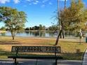 Scenic view of Chaparral Park with a tranquil lake and park bench under clear blue skies at 6401 N 82Nd Way, Scottsdale, AZ 85250