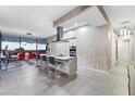 Open-concept kitchen featuring a large island with seating and stainless steel appliances at 7180 E Kierland Blvd # 1218, Scottsdale, AZ 85254