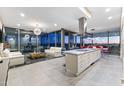 Bright open-concept living space featuring tile flooring, modern furnishings, and panoramic city views at 7180 E Kierland Blvd # 1218, Scottsdale, AZ 85254