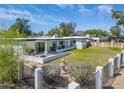 Expansive backyard view features lush green grass, patio, and stylish landscaping and fountain at 856 E Village Cir S Dr, Phoenix, AZ 85022