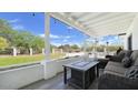 Relaxing covered patio with comfortable seating, charming string lights, and a view of the backyard at 856 E Village Cir S Dr, Phoenix, AZ 85022