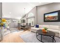 Bright living room featuring vaulted ceilings and modern décor and finishes at 8845 E Larkspur Dr, Scottsdale, AZ 85260