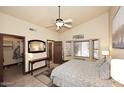 Relaxing main bedroom retreat with a large window, walk-in closet, and en-suite bathroom at 10974 S Dreamy Dr, Goodyear, AZ 85338