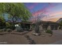 Charming single-story home with desert landscaping, mature trees, and a three car garage at 11088 E Acacia Dr, Scottsdale, AZ 85255