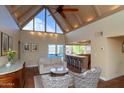 Bright living room with high ceilings, clerestory windows, and access to the outdoor pool area at 1302 E Nicolet Ave, Phoenix, AZ 85020