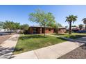 Lovely home with lush lawn, mature trees, and a neatly landscaped front yard at 1546 W Culver St, Phoenix, AZ 85007