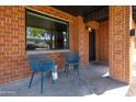 Inviting porch with seating, perfect for relaxing and enjoying the neighborhood views at 1546 W Culver St, Phoenix, AZ 85007