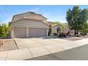 Beautiful two-story home featuring a three-car garage, desert landscaping, and a spacious driveway at 1975 E Chilton Dr, Tempe, AZ 85283