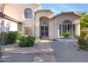 Inviting front entrance with a tiled walkway, desert landscaping, and security door at 1975 E Chilton Dr, Tempe, AZ 85283