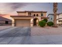 Charming two-story home featuring a two-car garage, well-maintained landscaping, and a tiled roof at 3007 S Calle Noventa --, Mesa, AZ 85212