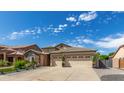 Charming single-Gathering home features a three-car garage and well-manicured landscaping at 3354 E Thornton Ave, Gilbert, AZ 85297