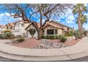 Lovely single-story home with desert landscaping, mature trees, and a view of a quiet suburban street at 3505 E South Fork Dr, Phoenix, AZ 85044