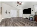 Open living room showcasing new flooring, vaulted ceilings, and access to the backyard at 36480 W El Greco St, Maricopa, AZ 85138