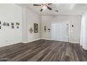 Spacious living room with new flooring, neutral paint, and sliding glass doors for natural light at 36480 W El Greco St, Maricopa, AZ 85138