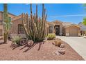 Inviting single-story home featuring desert landscaping, a two car garage, and neutral exterior paint at 4667 E County Down Dr, Chandler, AZ 85249