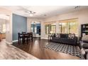 Bright living room featuring hardwood floors and comfortable seating, with lots of natural light at 4667 E County Down Dr, Chandler, AZ 85249