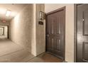 Apartment doorway in a hallway, featuring unit number 2015 and an exit sign at 5302 E Van Buren St # 2015, Phoenix, AZ 85008