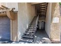 Exterior staircase leading to the units, showcasing unit numbers and access to residences at 5302 E Van Buren St # 2015, Phoenix, AZ 85008