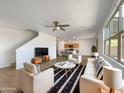 Bright living room with modern furniture, neutral walls, and stylish black and white rug at 7146 E Bobwhite Ct, San Tan Valley, AZ 85143