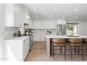 Bright kitchen with white cabinetry, stainless steel appliances, and a marble backsplash at 7648 N Via Del Paraiso --, Scottsdale, AZ 85258