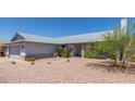 Single-story home with a desert landscape at 8020 W Windrose Dr, Peoria, AZ 85381