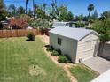 Spacious backyard featuring a shed and well maintained grass at 930 W Mackenzie Dr, Phoenix, AZ 85013
