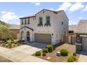 Beautiful stucco home featuring a tile roof, low maintenance landscaping, and an attached two-car garage at 9811 E Suburban Dr, Mesa, AZ 85212