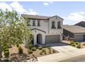 Attractive two-story home with a well-manicured front yard, tiled roof, and a convenient two-car garage at 9811 E Suburban Dr, Mesa, AZ 85212