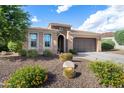 Inviting single-story home featuring desert landscaping with a cactus accent at 12780 W Desert Vista Trl, Peoria, AZ 85383