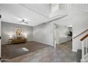 Spacious living room featuring neutral tones, plush carpet, and staircase at 1381 N Alexis Dr, Gilbert, AZ 85234