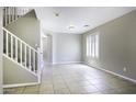 Bright living room featuring tiled flooring, fresh paint, and lots of natural light at 1390 E Kingman Pl, Casa Grande, AZ 85122