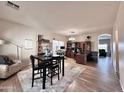 Spacious open-concept dining area adjoining office space and living area at 14578 W Evans Dr, Surprise, AZ 85379