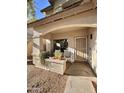 Inviting front porch with seating area, plants, and 'Welcome' sign at 14578 W Evans Dr, Surprise, AZ 85379