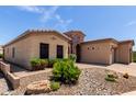 Charming single-story home with a landscaped front yard and beautiful brick driveway at 2111 N Piper Pl, Mesa, AZ 85215