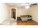 Inviting living room with hardwood floors and comfortable seating arrangement at 24027 W Antelope Trl, Buckeye, AZ 85326