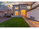 Inviting two-story home with manicured artificial turf and a stone walkway at 2754 E Michelle Way, Gilbert, AZ 85234