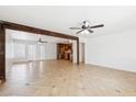 Open floor plan featuring tile flooring, a rustic beam, and a bright and airy feel at 3228 W Mercer Ln, Phoenix, AZ 85029