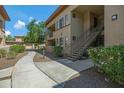 Multi-story condo building featuring well-maintained grounds, walkways, and convenient stair access at 3330 S Gilbert Rd # 1020, Chandler, AZ 85286