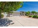 Charming home features a long driveway, desert landscaping, and a well-maintained front yard at 3544 E Fox St, Mesa, AZ 85213