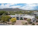 Beautiful home with desert landscaping, a circular driveway, and impressive mountain views at 39847 N 105Th Pl, Scottsdale, AZ 85262