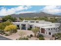 Stunning home with desert landscaping, a circular driveway, and panoramic mountain views at 39847 N 105Th Pl, Scottsdale, AZ 85262
