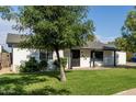 Cozy single-story home with a well-manicured lawn and appealing curb appeal at 819 N Robson --, Mesa, AZ 85201