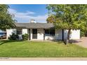 Charming single-story home with a well-maintained lawn, offering an attractive curb appeal at 819 N Robson --, Mesa, AZ 85201