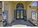 Inviting front entrance with double doors, sidelights, and a charming arched window above the doorway at 112 E Joseph Way, Gilbert, AZ 85295