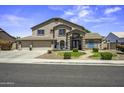 Beautiful two-story home with a well-manicured lawn and three car garage offers curb appeal and ample parking at 112 E Joseph Way, Gilbert, AZ 85295