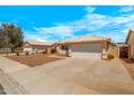 Lovely single-story home with a two-car garage, desert landscaping, and a clean, modern design at 16240 W Maricopa St, Goodyear, AZ 85338